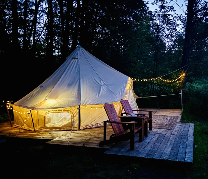 A tent with lights on the outside of it