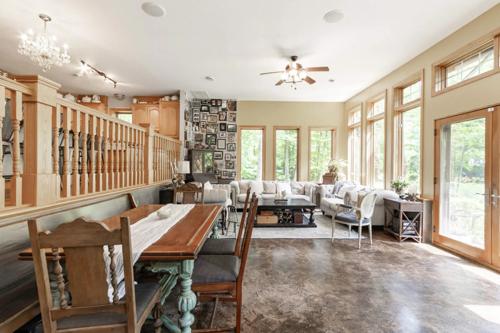 A large living room with a table and chairs