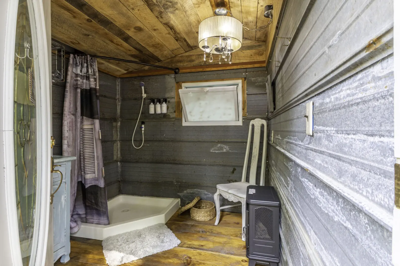 A bathroom with a toilet and shower in it