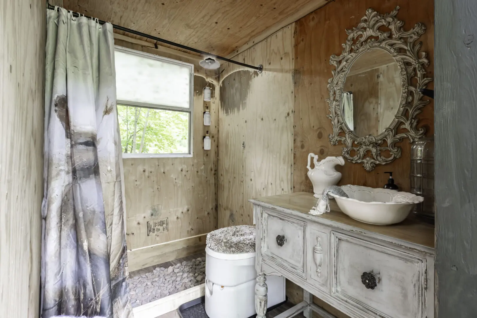 A bathroom with a sink and mirror in it